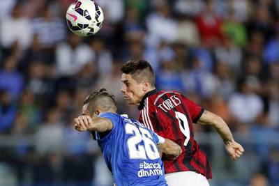 AC Milan's Fernando Torres heads the ball to score against Empoli during their Serie A 2-2 draw on Tuesday night. Giampiero Sposito / Reuters / September 23, 2014 