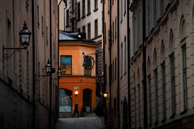 A woman walks in the old town of Sweden's capital Stockholm. AFP