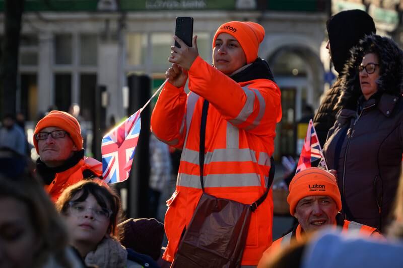 Council workers wait for the arrival of King Charles. Getty Images