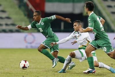Al Shabab’s Adel Abdullah, left, avoids a tackle while his teammate Carlos Villanueva looks on during their match against Emirates on Friday night. Al Ittihad