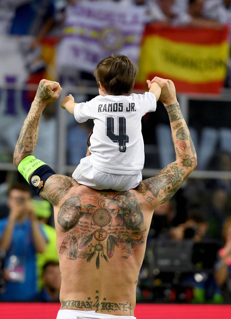 MILAN, ITALY - MAY 28:  Sergio Ramos of Real Madrid celebrates with his son after the UEFA Champions League Final match between Real Madrid and Club Atletico de Madrid at Stadio Giuseppe Meazza on May 28, 2016 in Milan, Italy.  (Photo by Matthias Hangst/Getty Images)
