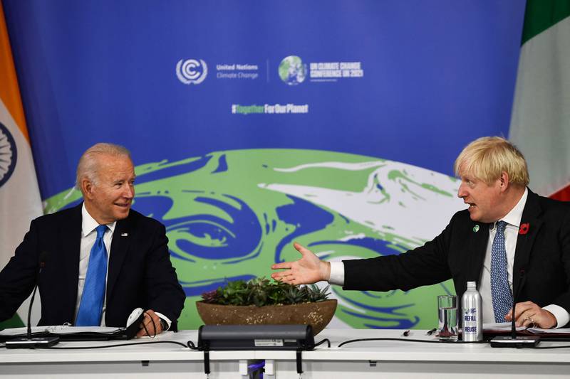 US President Joe Biden speaks to British Prime Minister Boris Johnson during a meeting on the 'Build Back Better World', part of the World Leaders' Summit at Cop26. AFP