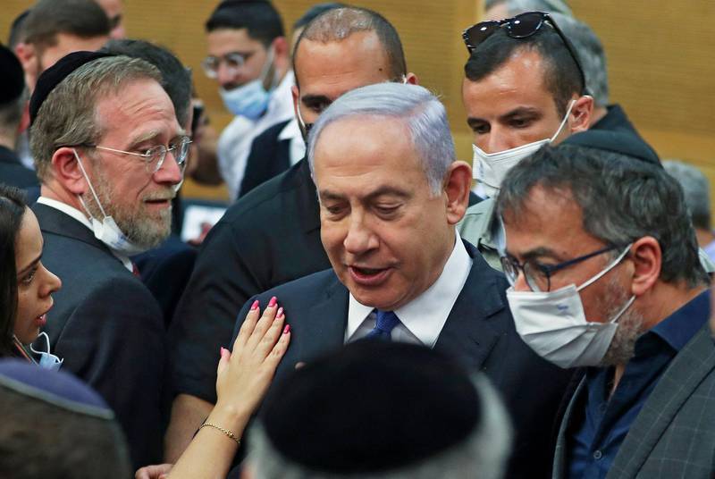 Israeli Prime Minister Benjamin Netanyahu attends a special session of the Knesset, Israel's parliament, in which MPs will elected a new president, in Jerusalem, on June 2, 2021. Israel's parliament elected the even-keeled Labor veteran Isaac Herzog as its 11th president, a vote that came as opposition lawmakers scrambled to forge a coalition to unseat Benjamin Netanyahu. Herzog, 60, beat former headmistress Miriam Peretz to replace President Reuven Rivlin, who was elected in 2014 to the largely ceremonial position decided by the parliament, or Knesset.
 / AFP / POOL / RONEN ZVULUN
