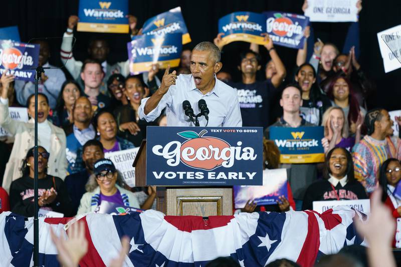 Mr Obama told attendees that Mr Warnock's opponent, Herschel Walker, was not qualified to be a senator. Getty / AFP