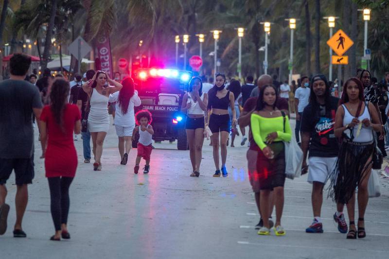 Miami Beach officers enforce nightly curfew in South beach after the city in Florida put in place strict measures to fight the spread of coronavirus.  EPA