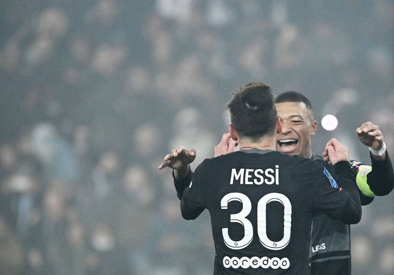 Paris Saint-Germain's Argentinian forward Lionel Messi celebrates with Kylian Mbappe. AFP