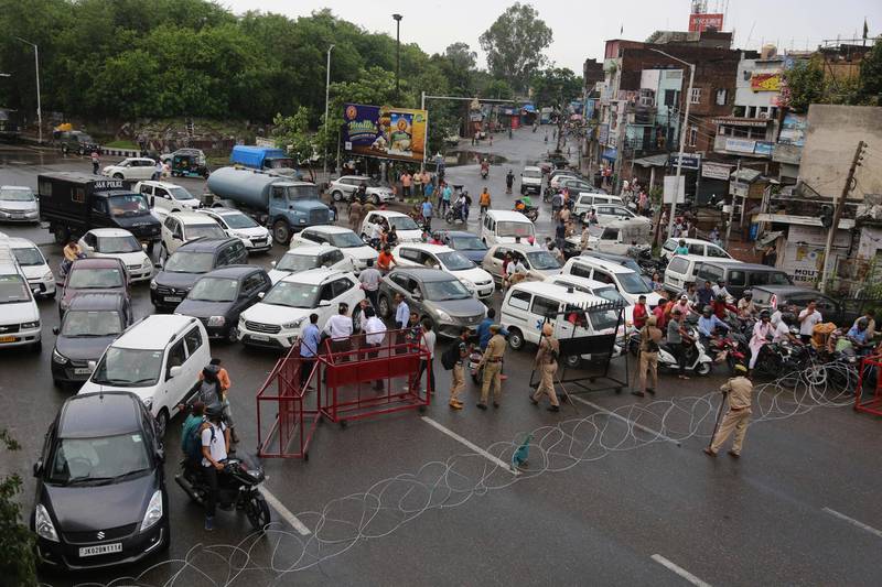 Barricades are set up by Indian police to prevent the movment of vehicles during curfew like restrictions in Jammu, India, Monday, August 5, 2019. AP Photo