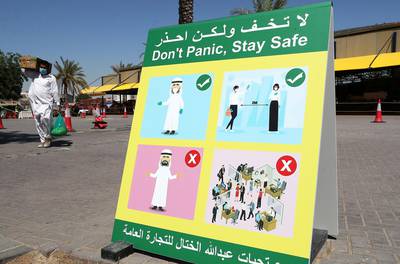 DUBAI, UNITED ARAB EMIRATES , May 5 – 2020 :- Don’t Panic, Stay Safe signboard at the Al Awir fruit & vegetable market in Dubai. UAE government ease the coronavirus restriction for the residents around the country. (Pawan Singh / The National) For News/Standalone/Online/Stock