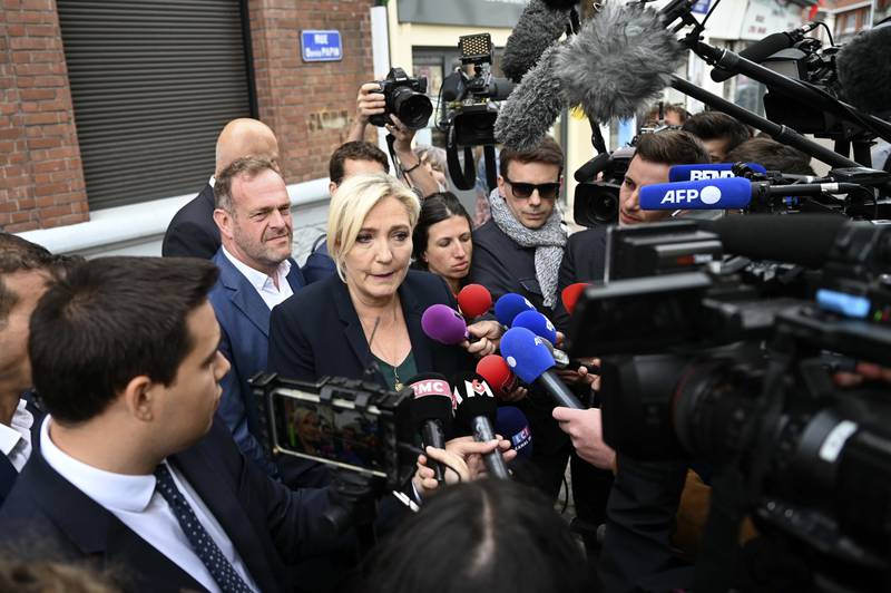Marine Le Pen, the leader of the far-right National Rally, addresses reporters after her party won 89 seats in the 577-seat parliament. AP