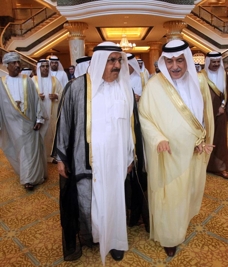 Saudi Finance Minister Ibrahim al-Assaf (R) arrives with Emirati Finance and Industry Minister Hamdan bin Rashed al-Maktoum to attend a meeting of finance ministers of oil-producing Gulf Cooperation Council monarchies focusing on economic development projects in the region, in the Emirati capital Abu Dhabi on May 7, 2011. AFP PHOTO/KARIM SAHIB (Photo by KARIM SAHIB / AFP)