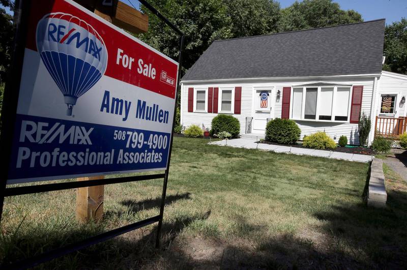 In this Monday, July 9, 2018, photo a for sale sign stands outside a pre-existing home, in Walpole, Mass. On Thursday, July 12, Freddie Mac reports on the weekâ€™s average U.S. mortgage rates. (AP Photo/Steven Senne)