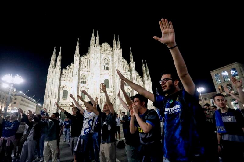 Inter supporters celebrate at the Duomo's Square, in Milan. EPA