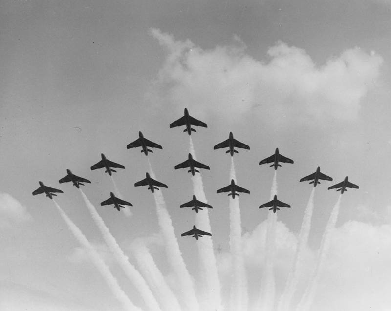 A formation of 16 Hawker Hunter jets of a Royal Air Force aerobatic team flying at the Farnborough Airshow in 1959.