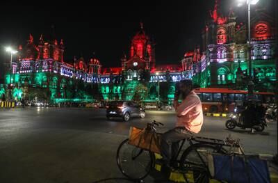The Chhatrapati Shivaji Maharaj Terminus, a World Heritage Site in Mumbai, illuminated in the colours of the Indian flag. EPA