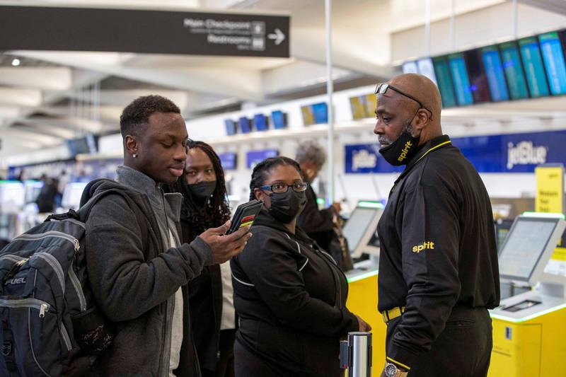 A Spirit Airlines service agent assists a passenger whose flight was delayed at Hartsfield-Jackson Atlanta International Airport in Georgia. Reuters