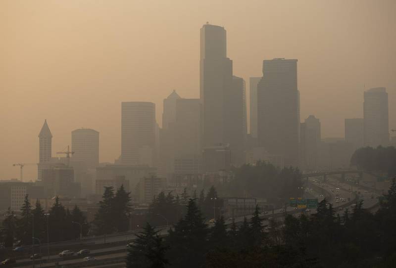 A haze caused by wildfire smoke shrouds skyline in Seattle, Washington. AFP