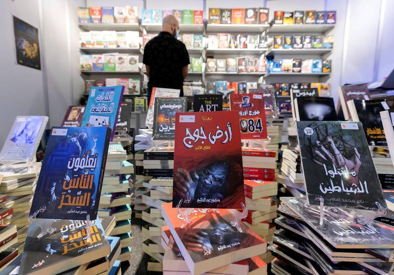 Sharjah, United Arab Emirates - Reporter: Razmig Bedirian. Arts and Culture. A visitor to Sharjah International Book Fair looks at books. Thursday, November 5th, 2020. Sharjah. Chris Whiteoak / The National