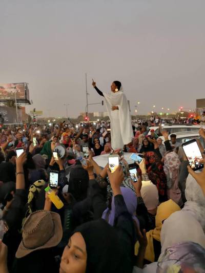 A Sudanese woman gestures during a protest demanding Sudanese President Omar Al-Bashir to step down along a bridge in Khartoum, Sudan April 8, 2019, in this still image taken from a social media video obtained on April 9, 2019. Courtesy Lana H. Haroun/via REUTERS ATTENTION EDITORS - THIS IMAGE HAS BEEN SUPPLIED BY A THIRD PARTY. MANDATORY CREDIT. NO RESALES. NO ARCHIVE
