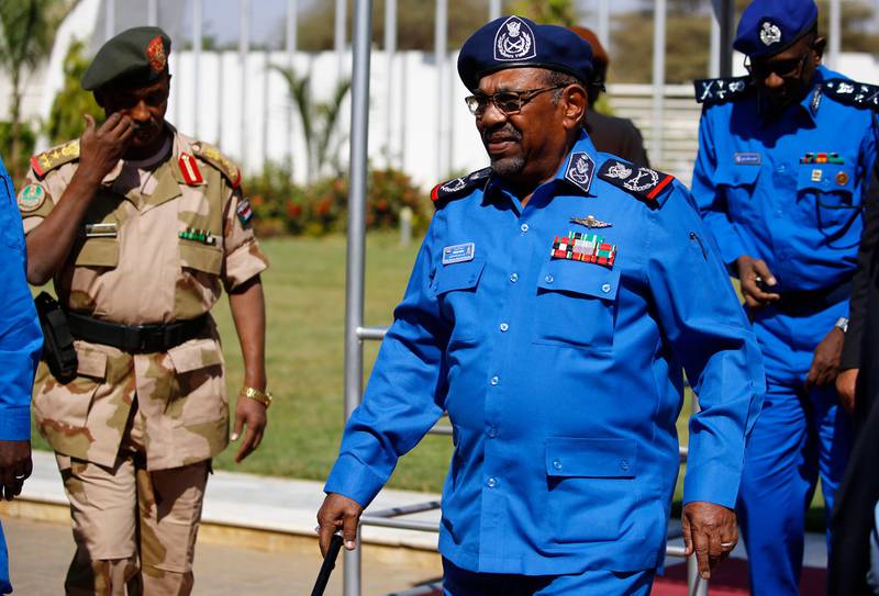 Sudanese President Omar al-Bashir arrives to meet with police officials at the headquarters of the "police house" in the capital Khartoum on December 30, 2018. Sudan's top Islamist party, a member of President Bashar el-Bashir's government, called on December 26 for a probe into the killings of protesters in demonstrations that have rocked the economically troubled country. Angry crowds have taken to the streets in Khartoum and several other cities since December 19 when the government tripled the price of bread.
 / AFP / ASHRAF SHAZLY
