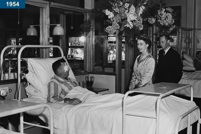 1954: The queen talking to an injured ex-serviceman during a visit to Repatriation General Hospital in Hobart, Australia.