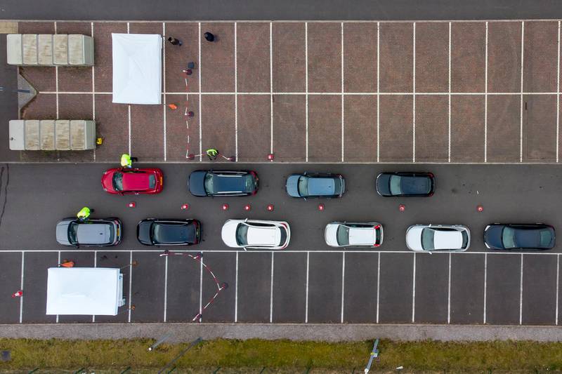 An aerial view of cars queuing at a temporary coronavirus testing centre in Stoke Gifford. Testing efforts were expanded in South Gloucestershire after three returning residents were recently found to have been infected with a Covid-19 variant first discovered in Brazil. Getty Images
