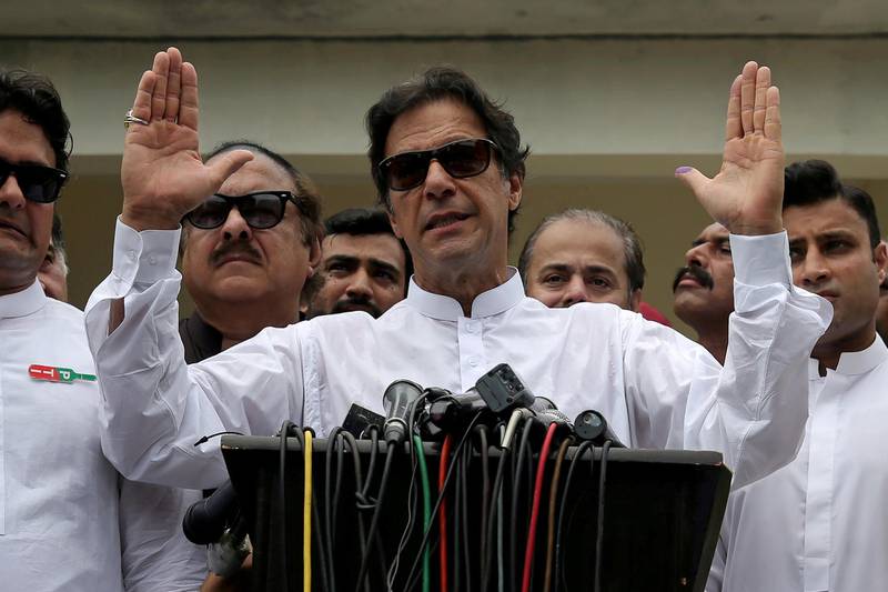 FILE PHOTO: Cricket star-turned-politician Imran Khan, chairman of Pakistan Tehreek-e-Insaf (PTI), speaks after voting in the general election in Islamabad, Pakistan July 25, 2018. REUTERS/Athit Perawongmetha/File Photo