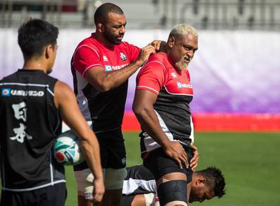 Japan's flanker Michael Leitch and lock Isileli Nakajima get ready for training. AFP