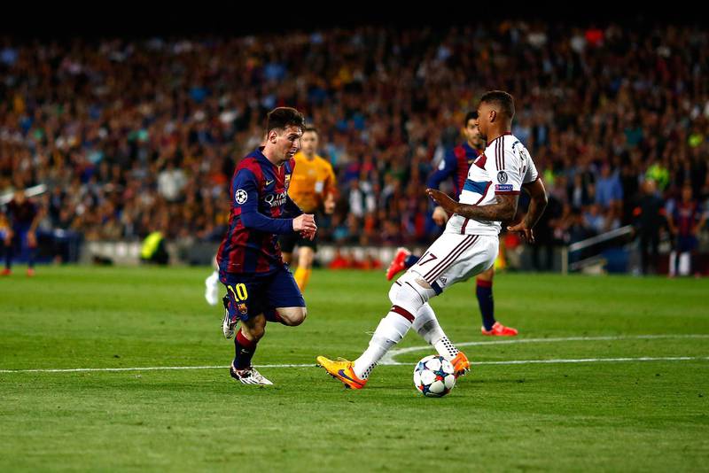 BARCELONA, SPAIN - MAY 06:  Lionel Messi of Barcelona passes by Jerome Boateng of Bayern to score his second goal during the first leg of UEFA Champions League semifinal match between FC Barcelona and FC Bayern Muenchen at Camp Nou on May 6, 2015 in Barcelona, Spain.  (Photo by Vladimir Rys Photography/Getty Images)