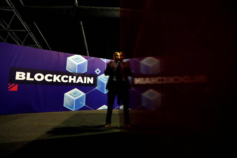 FILE PHOTO: A delegate talks on his phone at the Delta Summit, Malta's official Blockchain and Digital Innovation event promoting cryptocurrency, in Ta' Qali, Malta October 3, 2019.   REUTERS/Darrin Zammit Lupi/File Photo