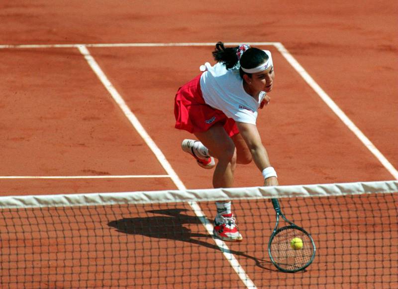 5 JUNE 1994:  ARANTXA SANCHEZ-VICARIO STRETCHES TOWARDS THE NET TO HIT THE RETURN AGAINST MARY PIERCE OF FRANCE IN THE WOMENS FINAL OF THE FRENCH OPEN TENNIS AT ROLAND GARROS IN PARIS, CONTINUED TODAY AFTER IT WAS STOPPED BY HEAVY RAIN YESTERDAY. Mandatory Credit: Gary Prior/ALLSPORT/Getty Images