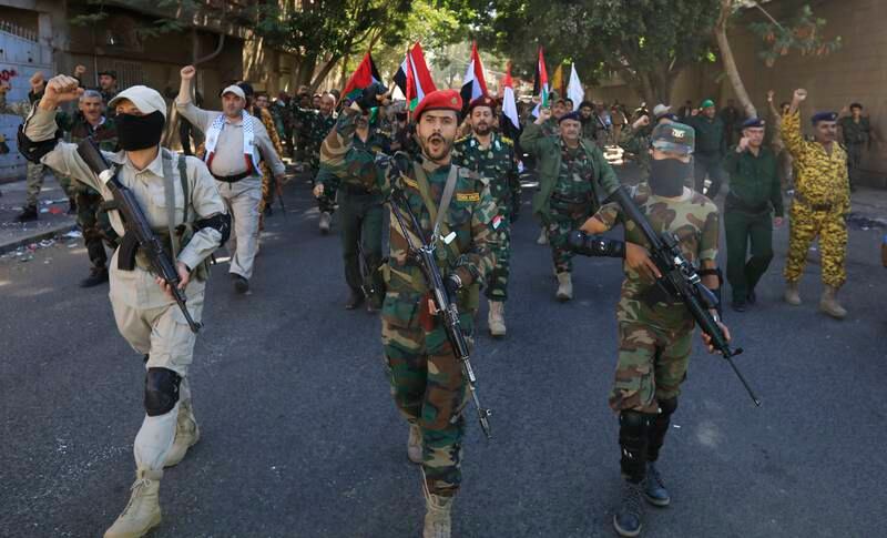 Houthi fighters march with Palestinian flags during a military parade in Sanaa, Yemen, October 12, 2023. EPA