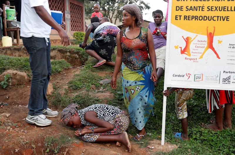 FILE PHOTO: A mother of a child, suspected of dying from Ebola, cries outside a hospital during the funeral in Beni, North Kivu Province of Democratic Republic of Congo, December 17, 2018.   REUTERS/Goran Tomasevic/File Photo