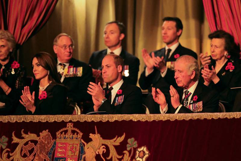 The king with Prince William and his wife Kate at the Royal British Legion Festival of Remembrance at the Royal Albert Hall in London. AFP