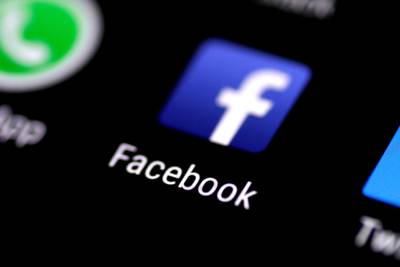 FILE PHOTO: The Facebook application is seen on a phone screen August 3, 2017. REUTERS/Thomas White/File Photo