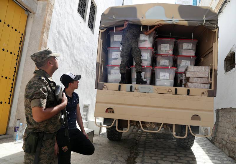 Tunisia army soldiers stand guard as polling agents transport ballot boxes and election material to be distributed to polling stations,  ahead of tomorrow's presidential election in Tunis, Tunisia. The first round of the presidential election in Tunisia will be held on 15 September.  EPA
