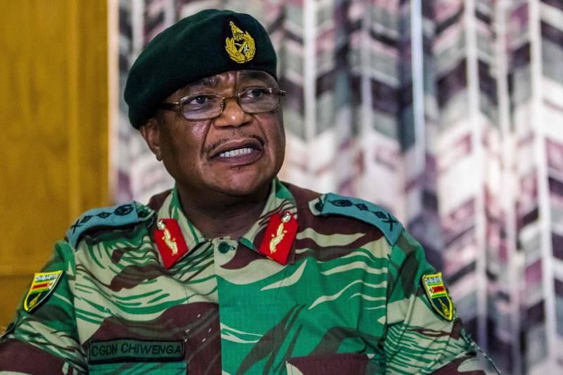 (FILES) This file photo taken on November 13, 2017 shows Army General Constantino Chiwenga Commander of the Zimbabwe Defence Forces addressing a media conference held at the Zimbabwean Army Headquarters in Harare.
Zimbabwe's ruling party on November 14, 2014 accused the army chief of "treasonable conduct" after he challenged President Robert Mugabe over the sacking of the vice president, in the latest sign of worsening instability. The ZANU-PF party said in a statement that general Constantino Chiwenga's criticism was "clearly calculated to disturb national peace... and suggests treasonable conduct on his part as this was meant to incite insurrection."
 / AFP PHOTO / Jekesai NJIKIZANA