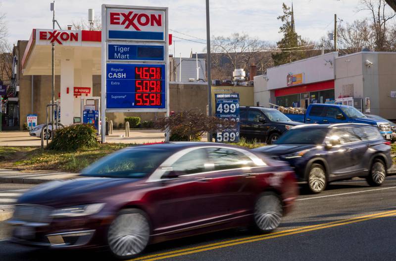 Cars drive near a petrol station in Washington. AFP