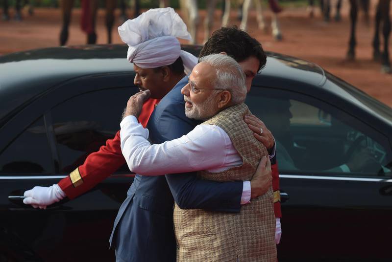 India's Prime Minister Narendra Modi embraces Canada's Prime Minister Justin Trudeau upon the latter's arrival to the Presidential Palace in New Delhi on February 23, 2018. Mr Trudeau and his family are on a week-long official trip to India. Prakash Singh / AFP