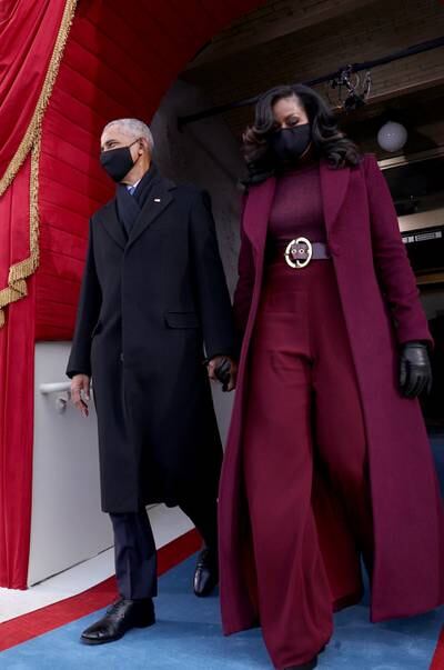 Former president Barack Obama and Michelle Obama, in Sergio Hudson, arrive before the inauguration of Joe Biden. EPA