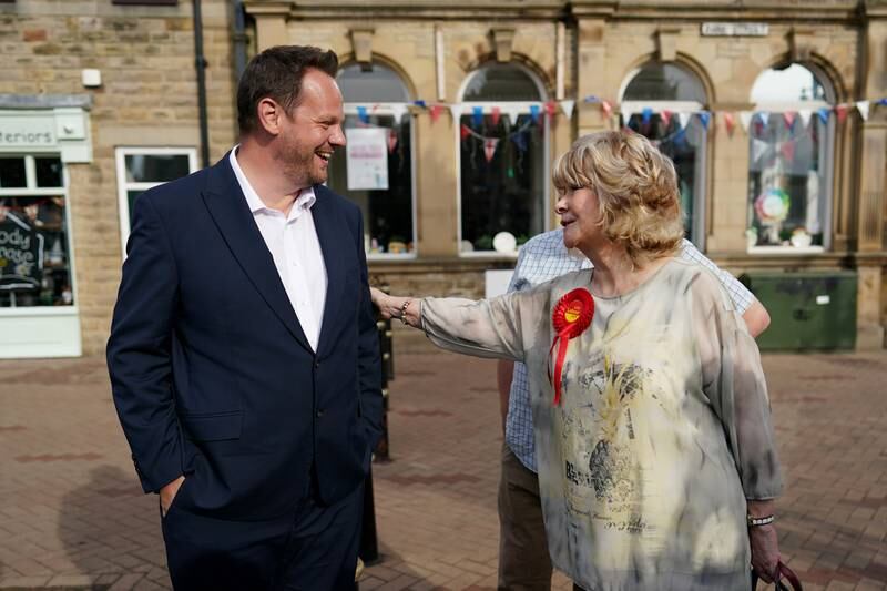 Mr Lightwood is congratulated by a supporter after winning the Wakefield by-election. Getty Images