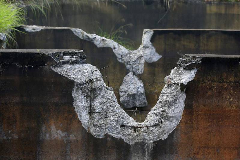 The damaged walls of a cistern are seen at a closed realgar mining plant at Heshan village. Jason Lee / Reuters