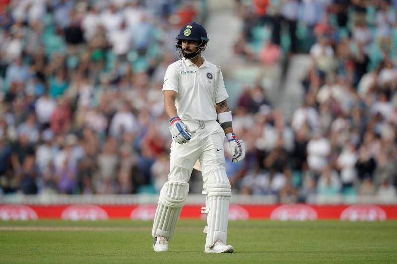India captain Virat Kohli walks off the field of play after losing his wicket from the bowling of England's Stuart Broad during the fifth cricket test match of a five match series between England and India at the Oval cricket ground in London, Monday, Sept. 10, 2018. (AP Photo/Matt Dunham)