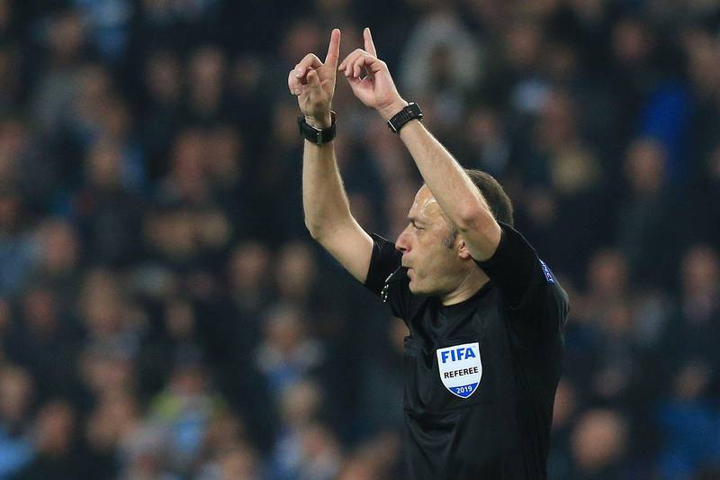 Turkish referee Cuneyt Cakir calls for a VAR decision on Tottenham Hotspur striker Fernando Lorente's goal. The goal was allowed to stand. AFP
