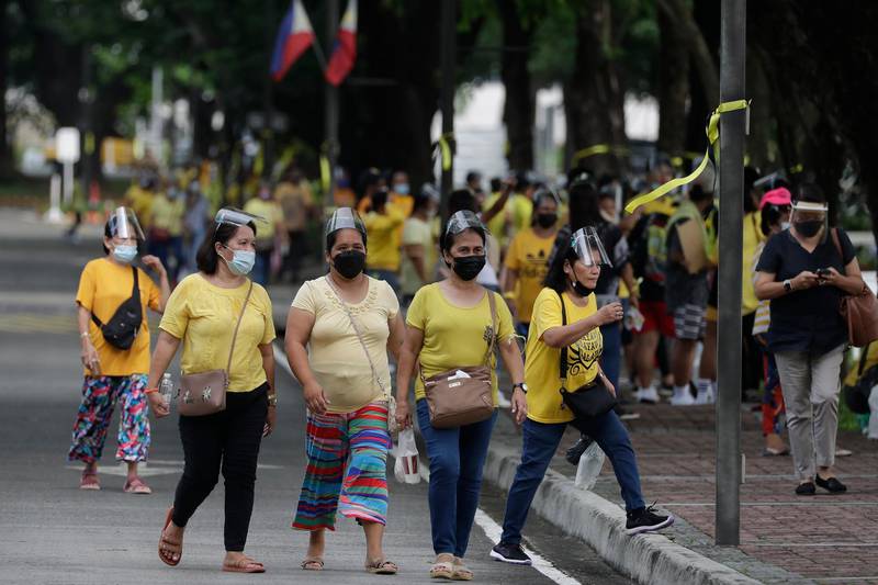 Supporters of former Philippine President Benigno Aquino III attend the public viewing of his urn. AP Photo