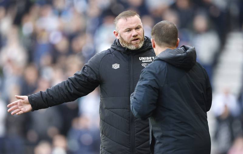 Derby County manager Wayne Rooney, left, during a Championship match against Bristol City at Pride Park on April 23, 2022. PA