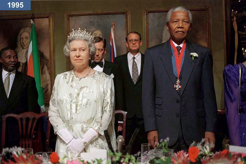 1995: The queen at a banquet in Cape Town, South Africa, with president Nelson Mandela.