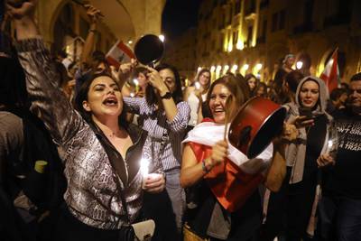 Lebanese anti-government protesters bang on pots and pans during a demonstration in the capital Beirut.  AFP