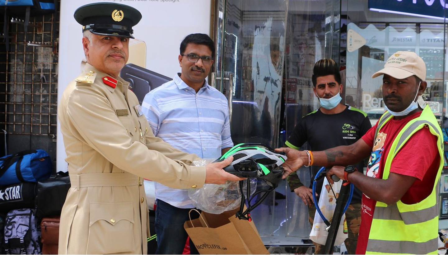 Officers from Al Raffa Police Station in Dubai educate e-scooter riders and cyclists about traffic rules. Photo: Dubai Police