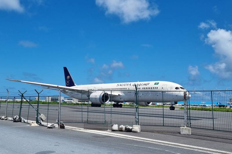 A Saudia airline Boeing 787 Dreamliner bound for Singapore and carrying Sri Lanka's fleeing president Gotabaya Rajapaksa, his wife and bodyguards prepares to take off at the Velana International airport, in the Maldives. AFP