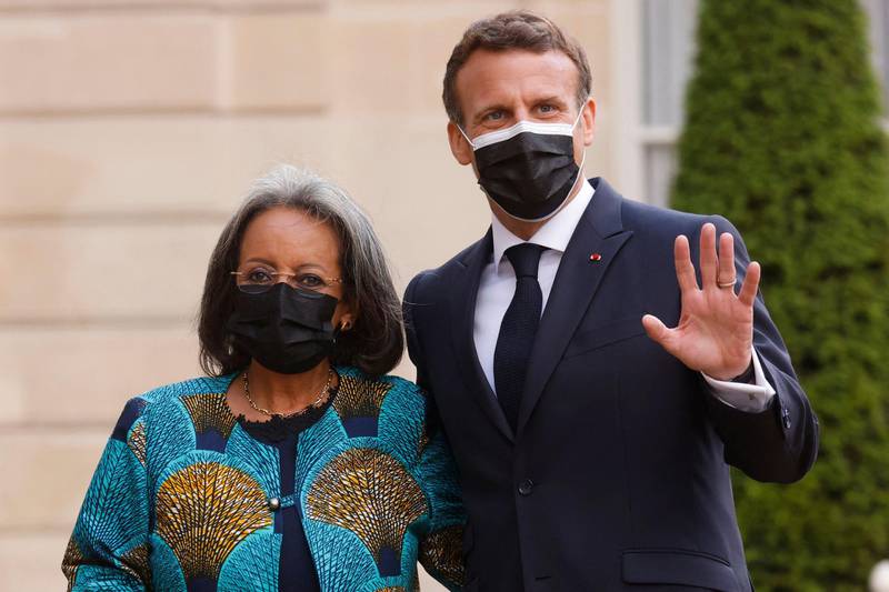 France's President Emmanuel Macron welcomes Ethiopia's President Sahle-Work Zewde upon her arrival for a dinner at the Elysee Presidential Palace in Paris. AFP